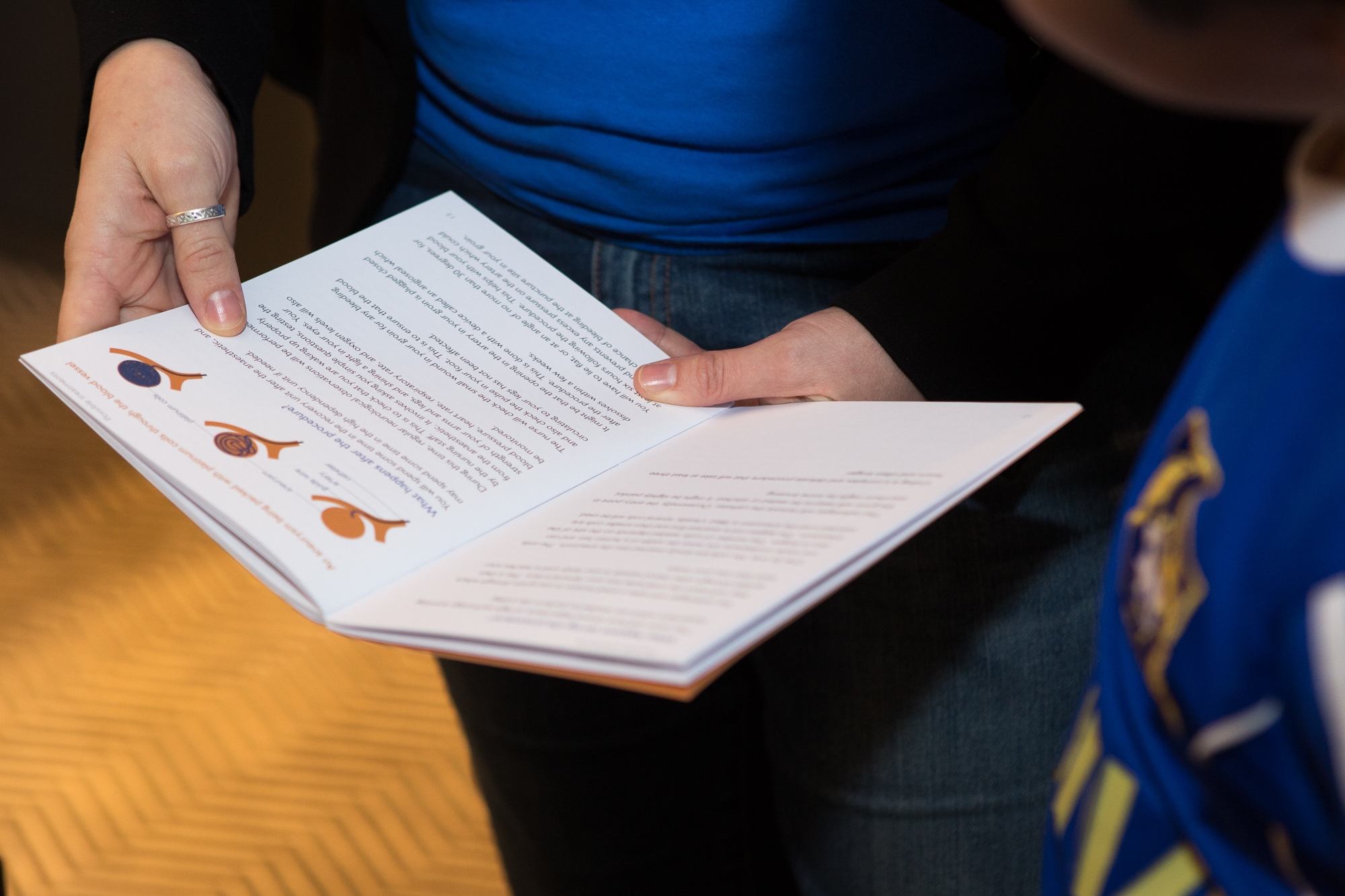 A person reads a booklet about the brain