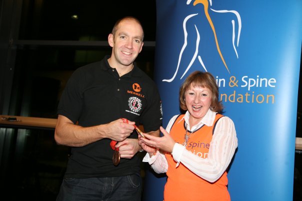 London Marathon runner receiving medal