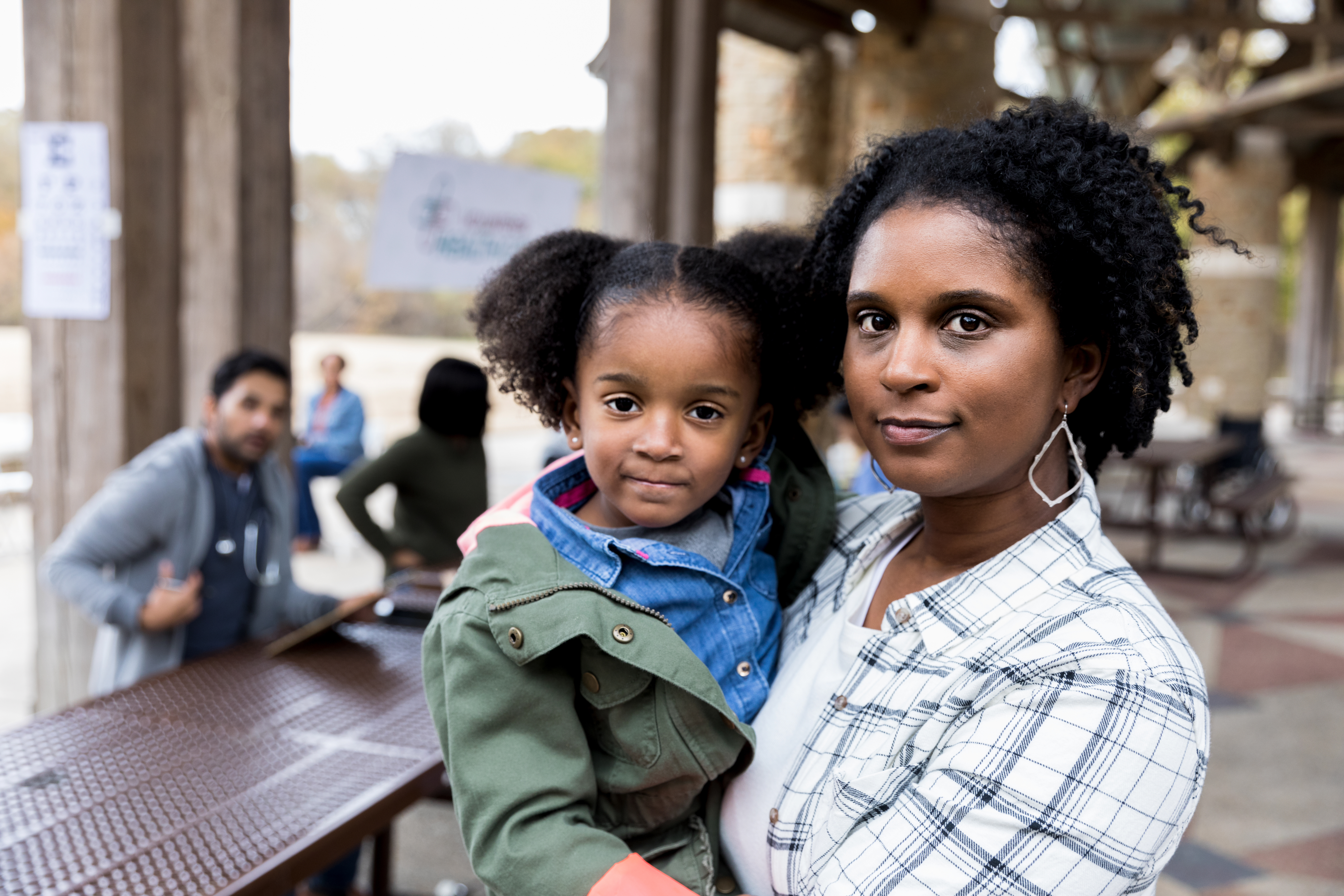 A woman holds her child